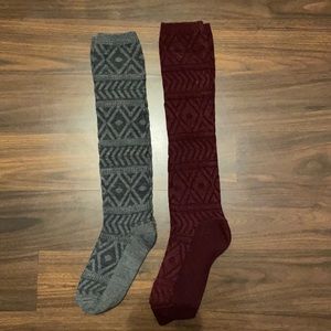 Two pairs of boot socks, one grey and one maroon.